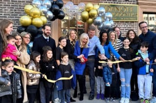 Group of people at a ribbon cutting